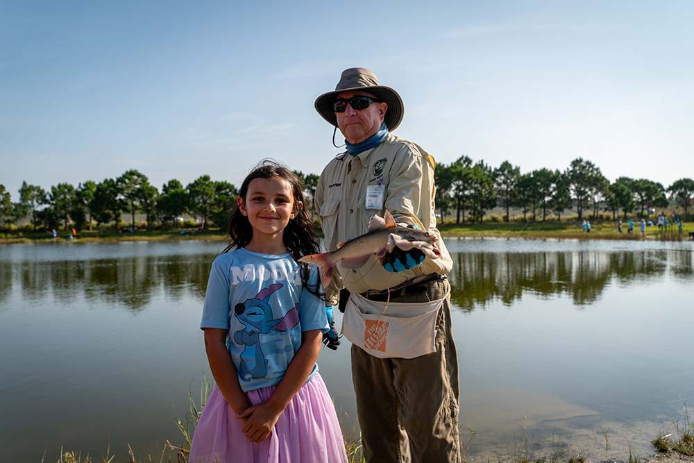 Kids Fishing Tournament judging fish sizes