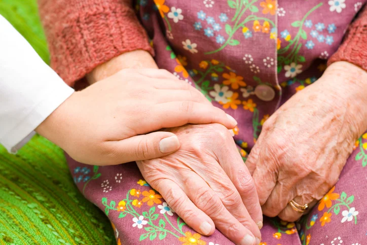 A Photo of Elder Hands Being Held
