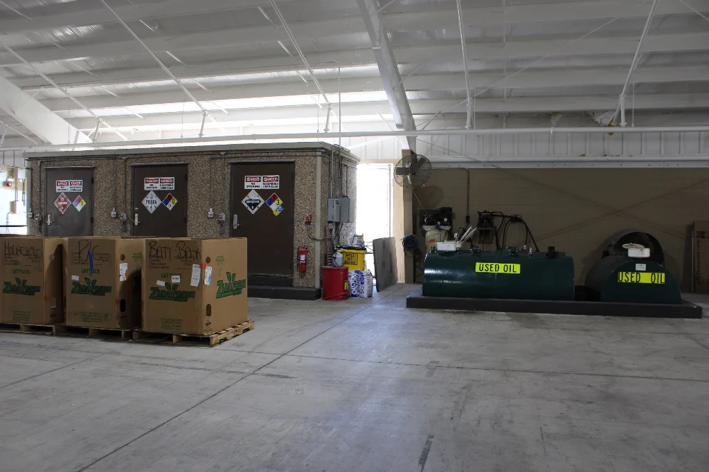 Warehouse with large boxes and used oil repositories